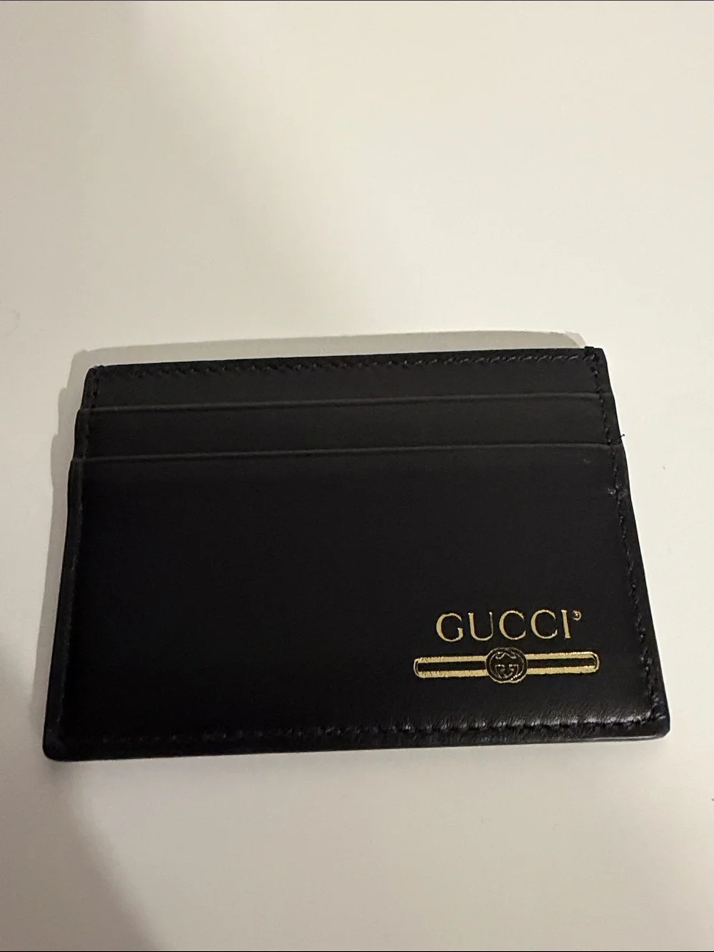 Gucci Black Leather Card Sleeve with Gold Logo Accent